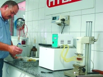 Laboratory technician Flip Scheepers prepares a batch of oil samples form a local oil producer for testing on the ferrous metal counter